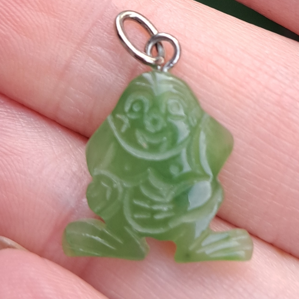 Six stylized Buddha type pendants